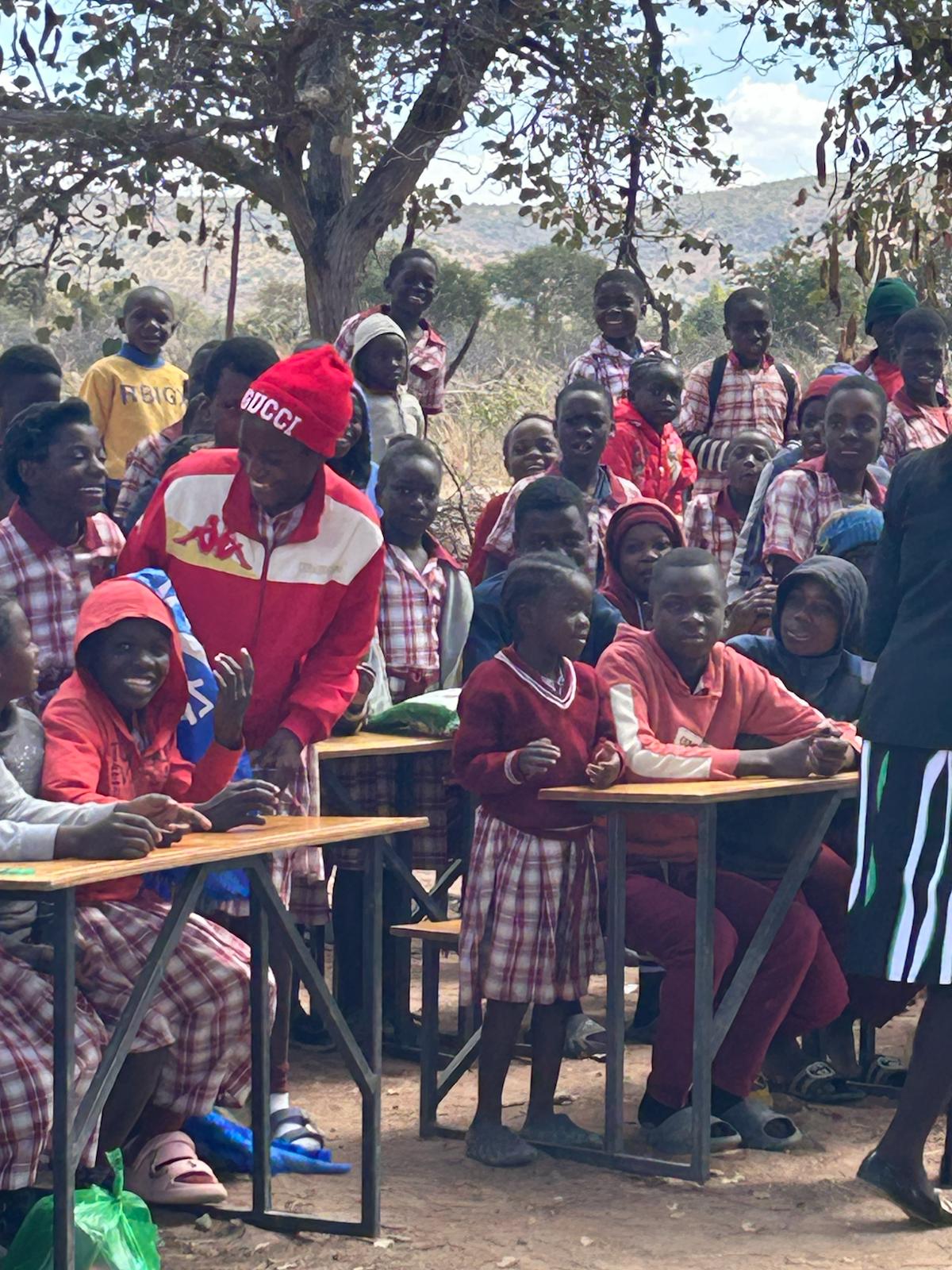 School children in uniforms waiting in line