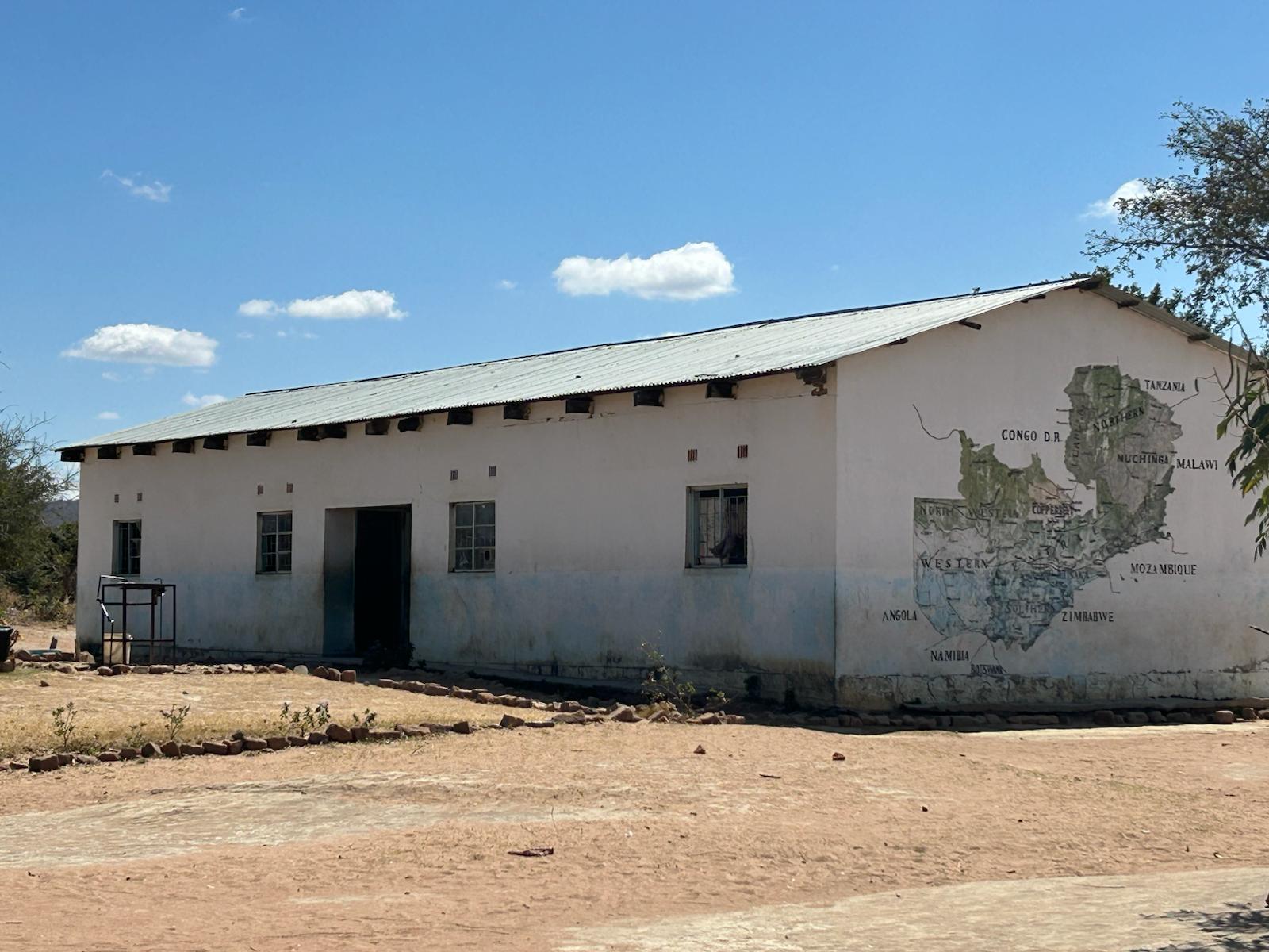 Community school building with Africa map
